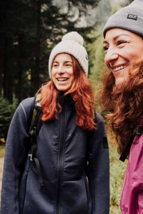 Two woman laughing in the countryside